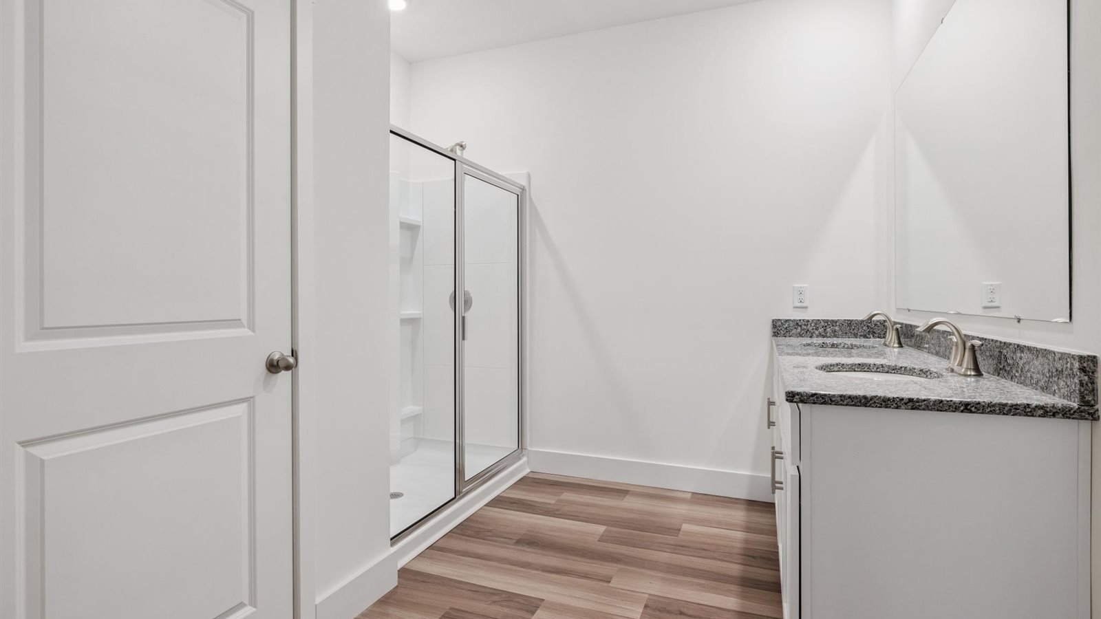 Primary bathroom with luxurious shower and built in storage