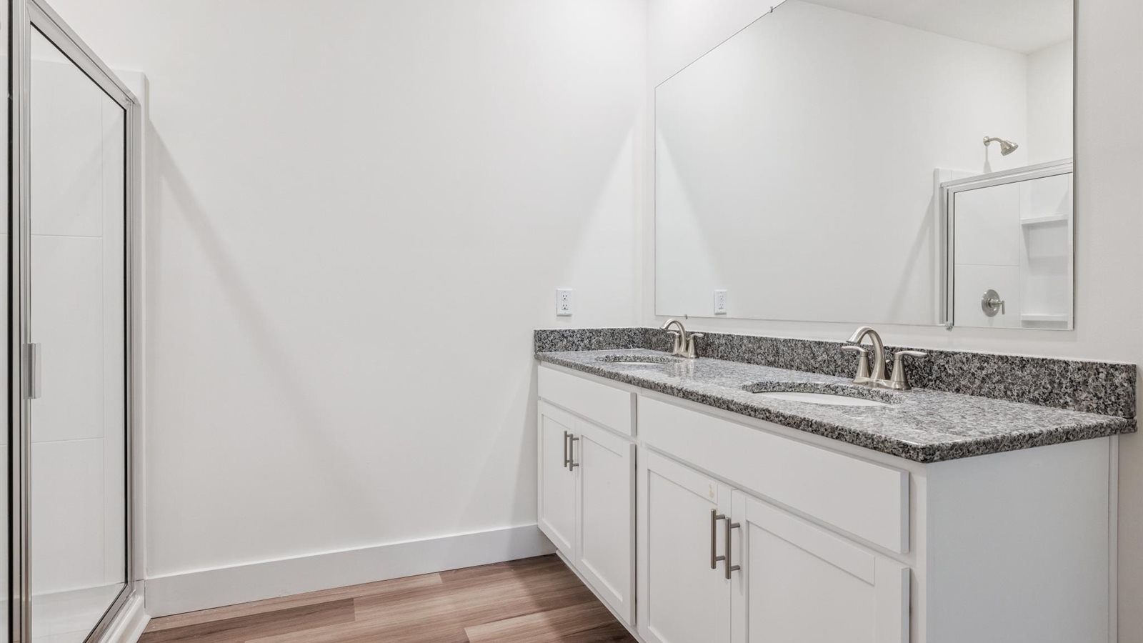 Primary bathroom with luxurious shower and built in storage