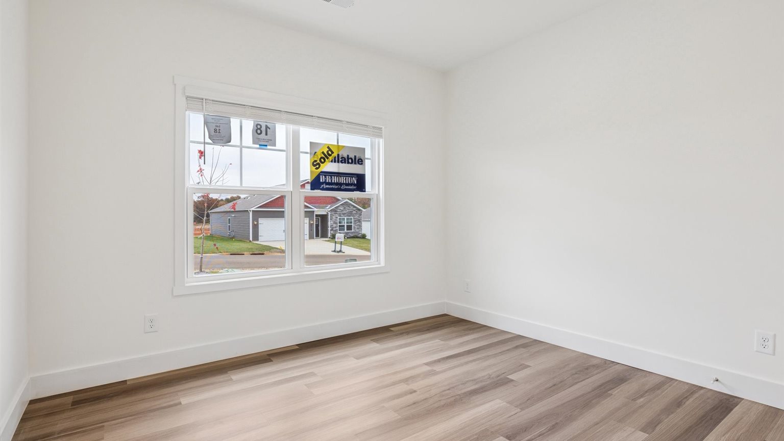 Bedroom with ample natural light and carpet floors