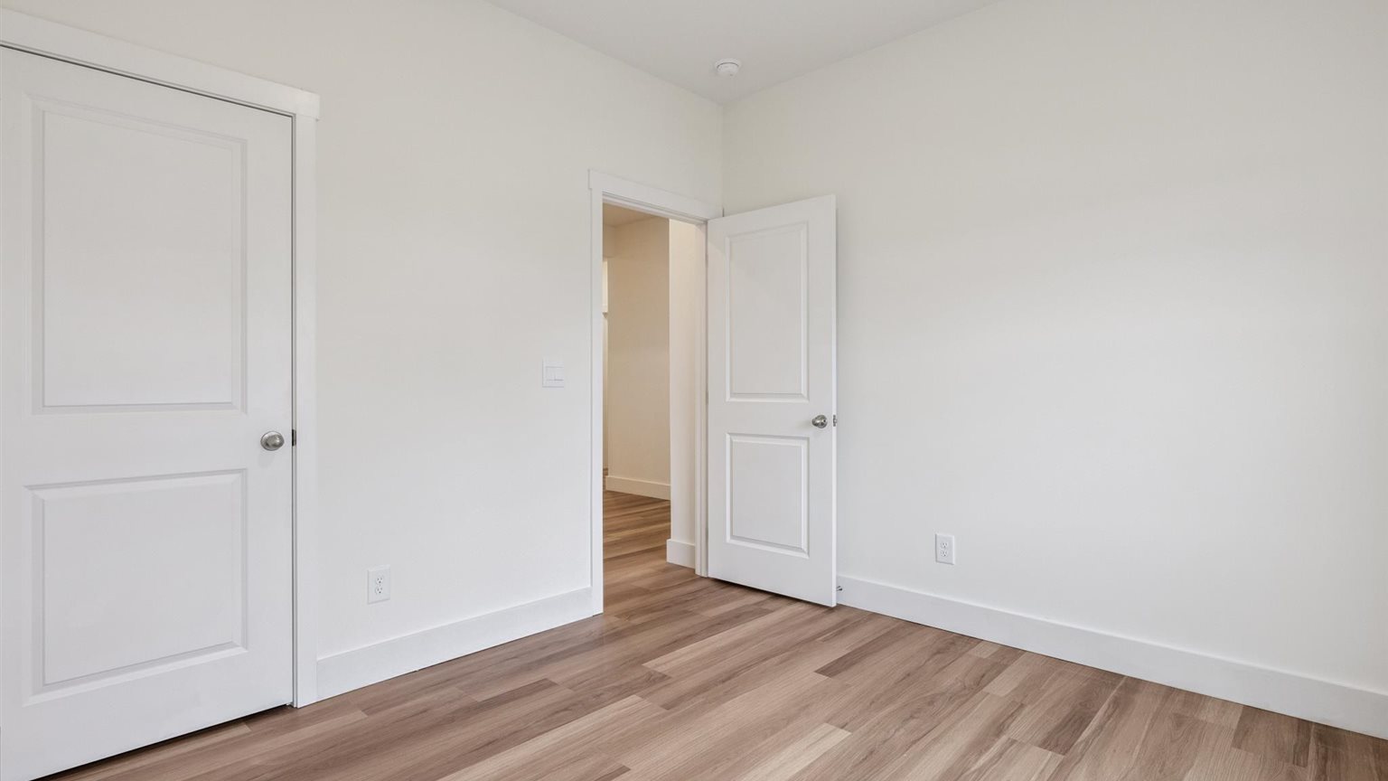 Bedroom with ample natural light and carpet floors