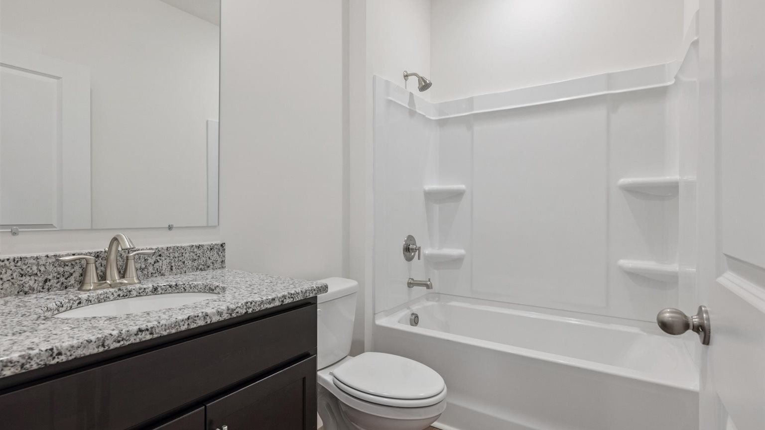 Upstairs bathroom with combination shower and bathtub