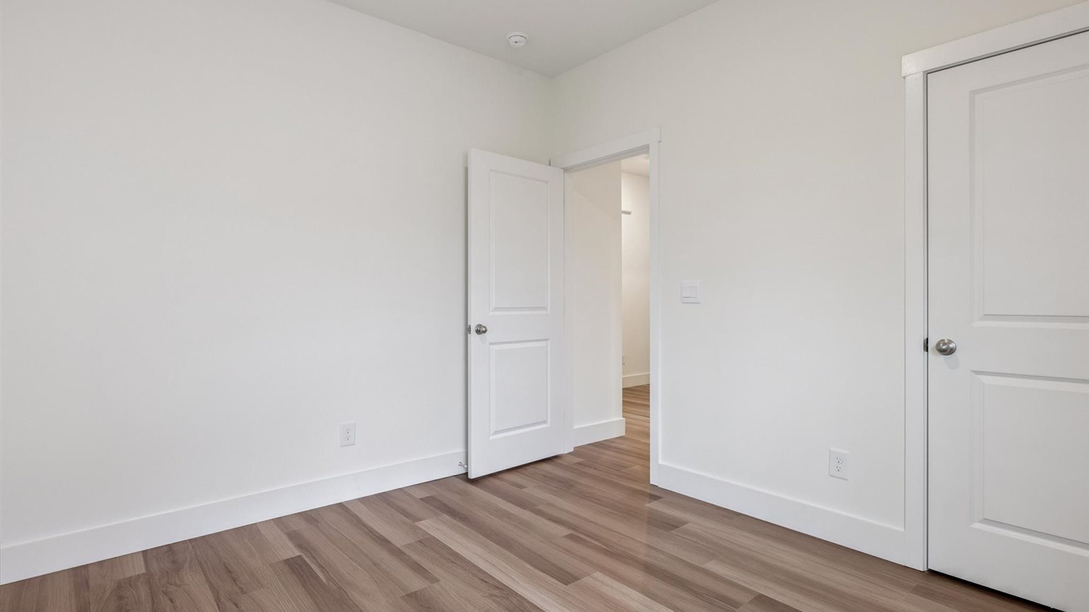 Bedroom with ample natural light and carpet floors