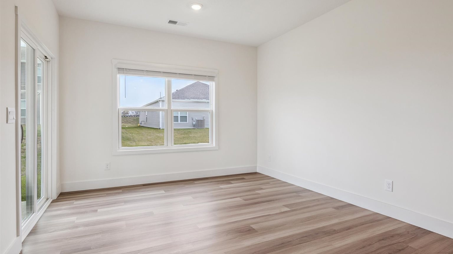 Bedroom with ample natural light and carpet floors