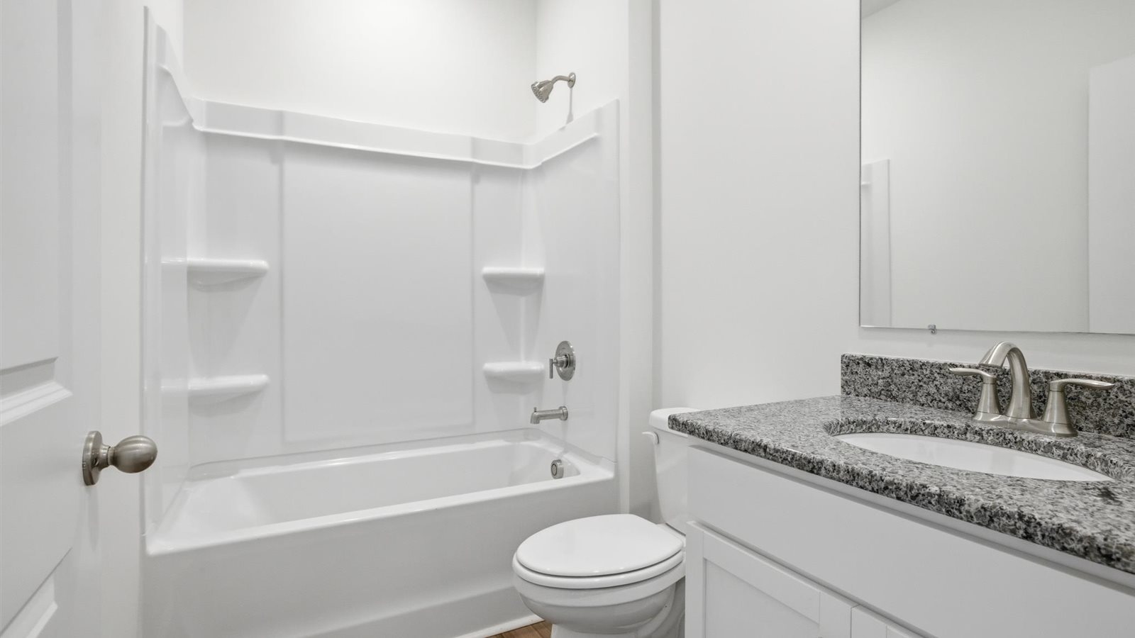 Guest bathroom with built in vanity and combination bathtub shower