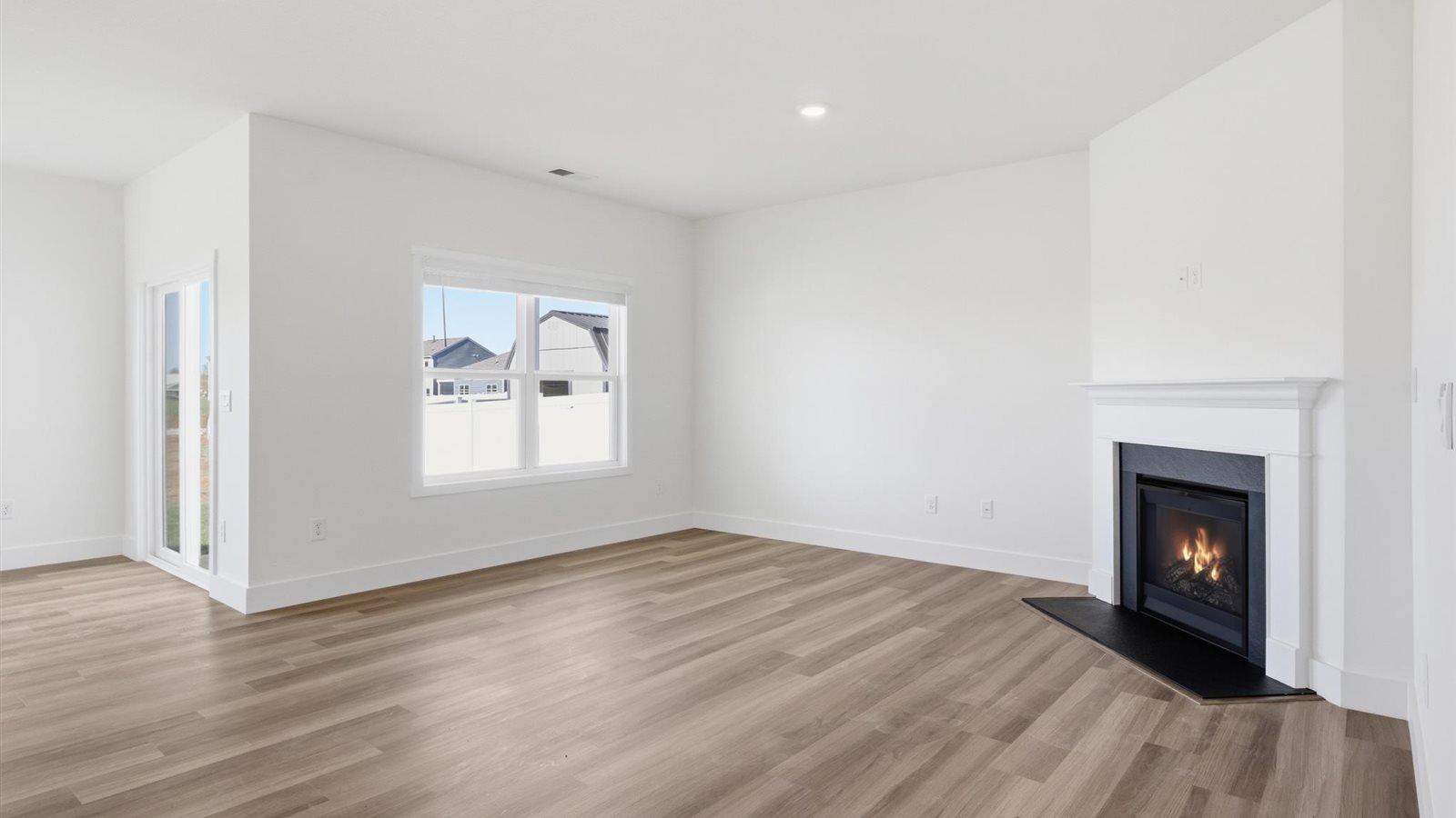 Spacious living and great  room space with light allowing windows