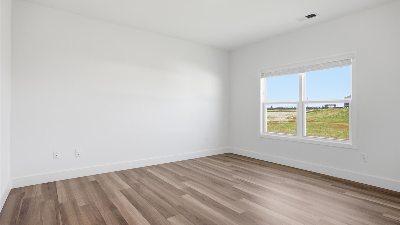 Primary bedroom with private attached bathroom and walk-in closet