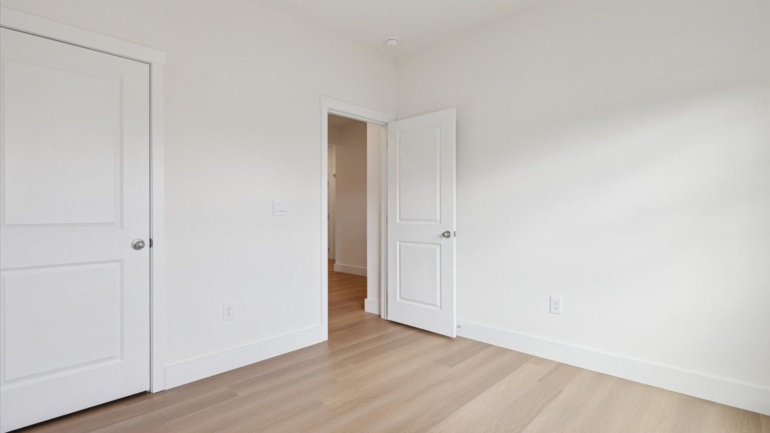 Bedroom with ample natural light and carpet floors