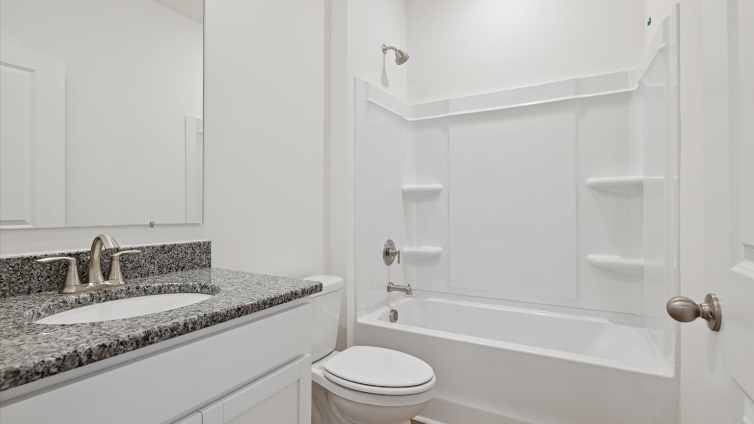 Guest bathroom with built in vanity and combination bathtub showerGuest bathroom with built in vanity and combination bathtub shower