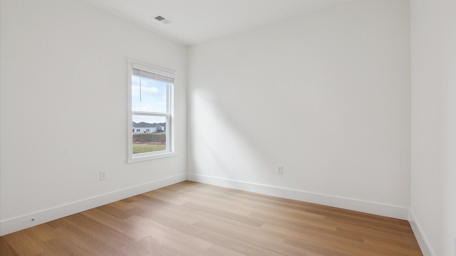 Bedroom with ample natural light and carpet floors