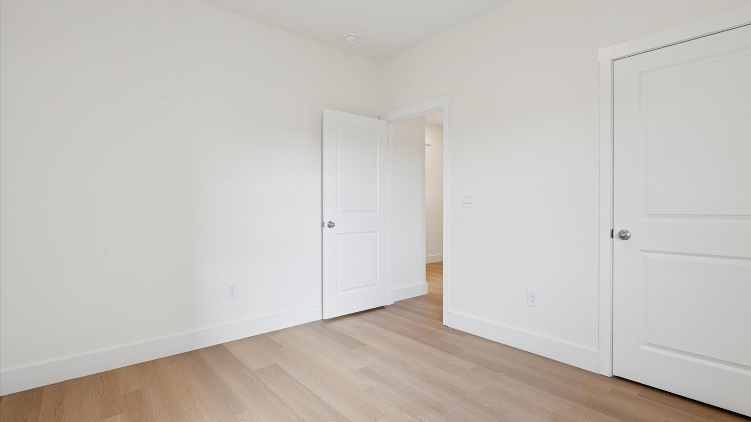Bedroom with ample natural light and carpet floors