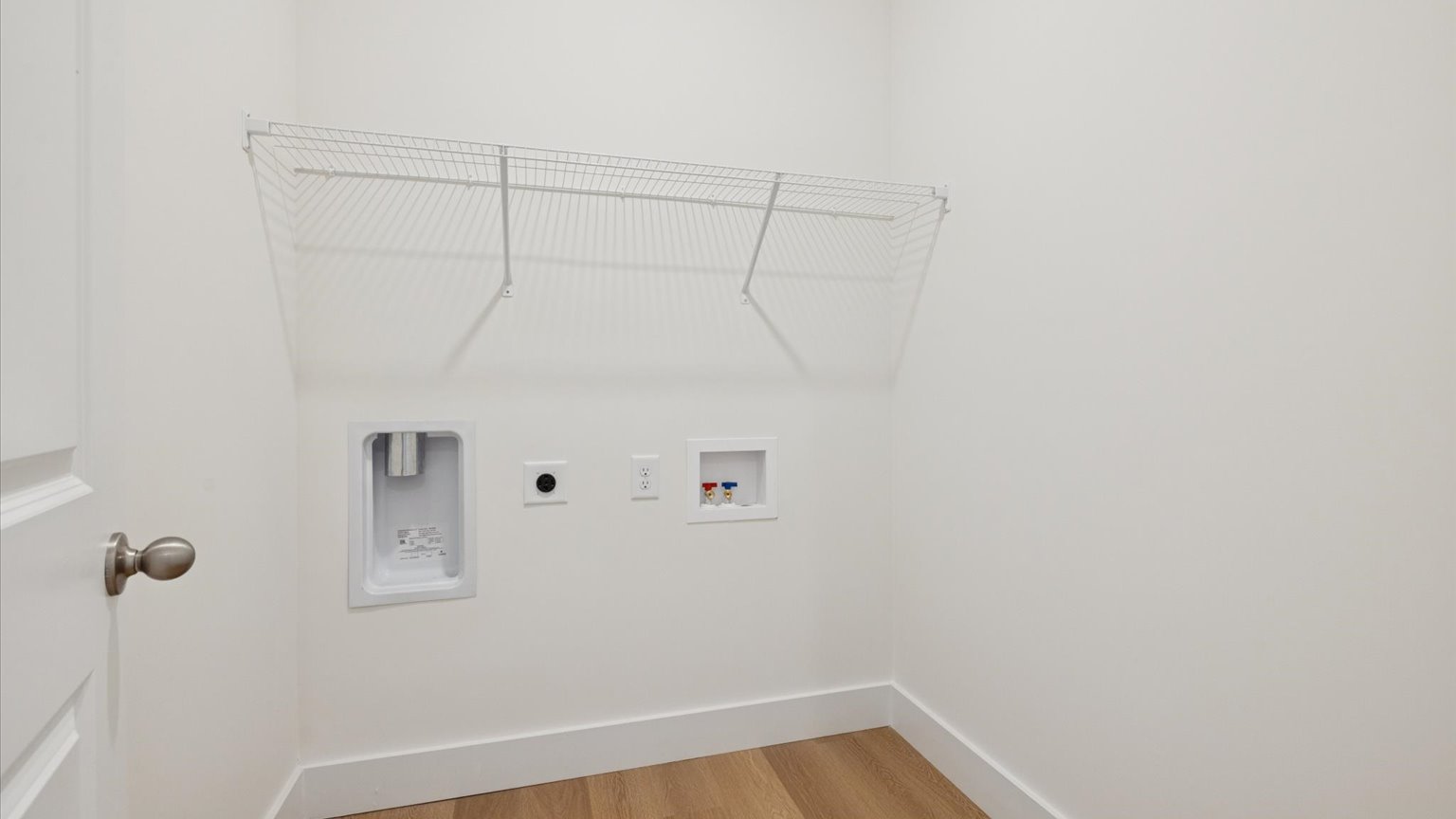 Laundry room and utility closet space with extra storage