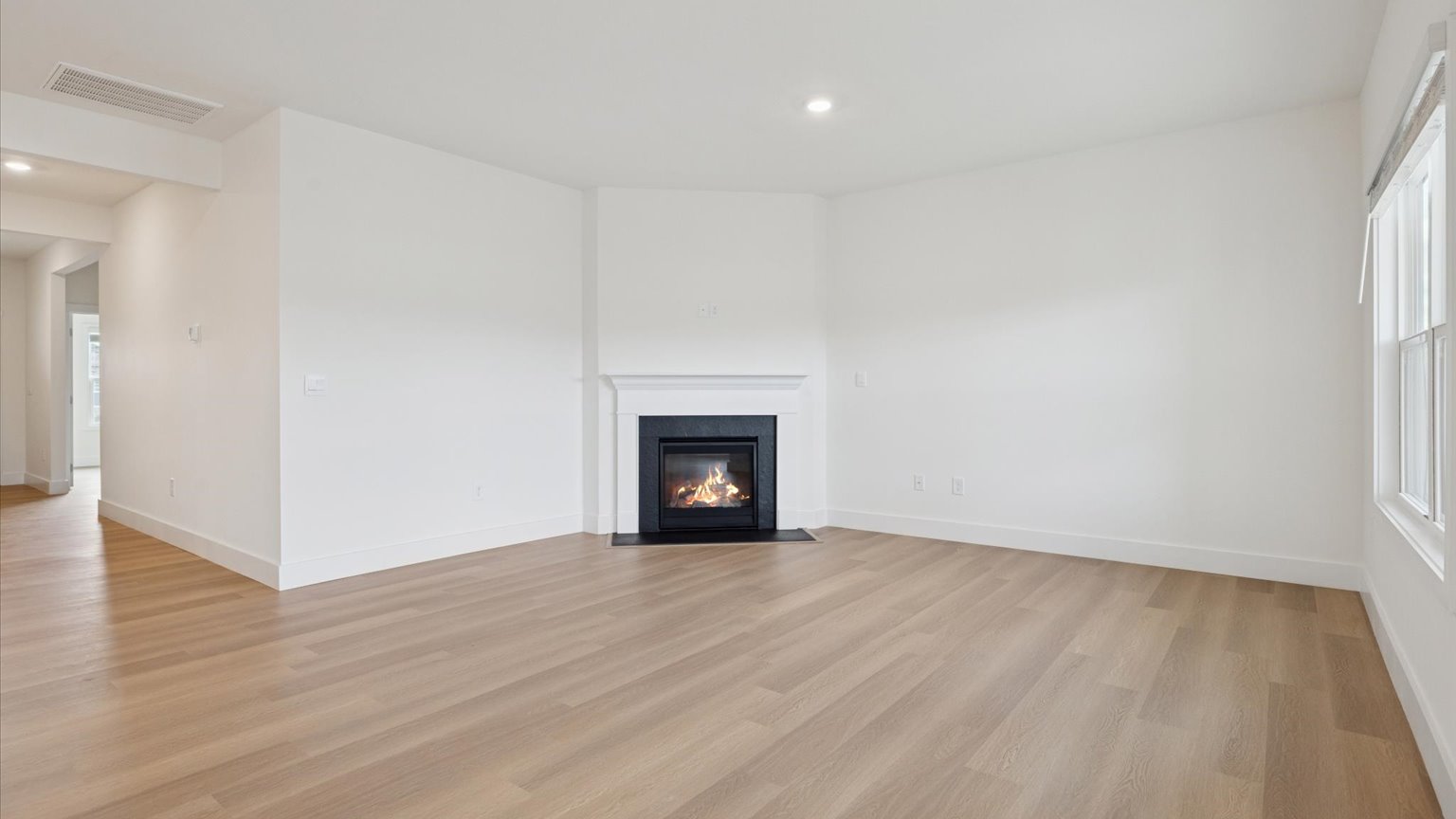 Open living and great room area with ample natural light