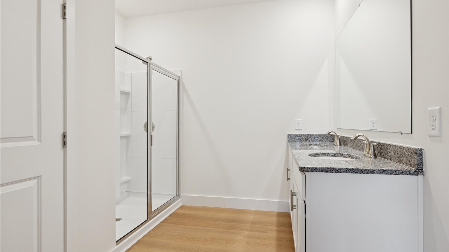 Private attached primary bathroom with built in vanity