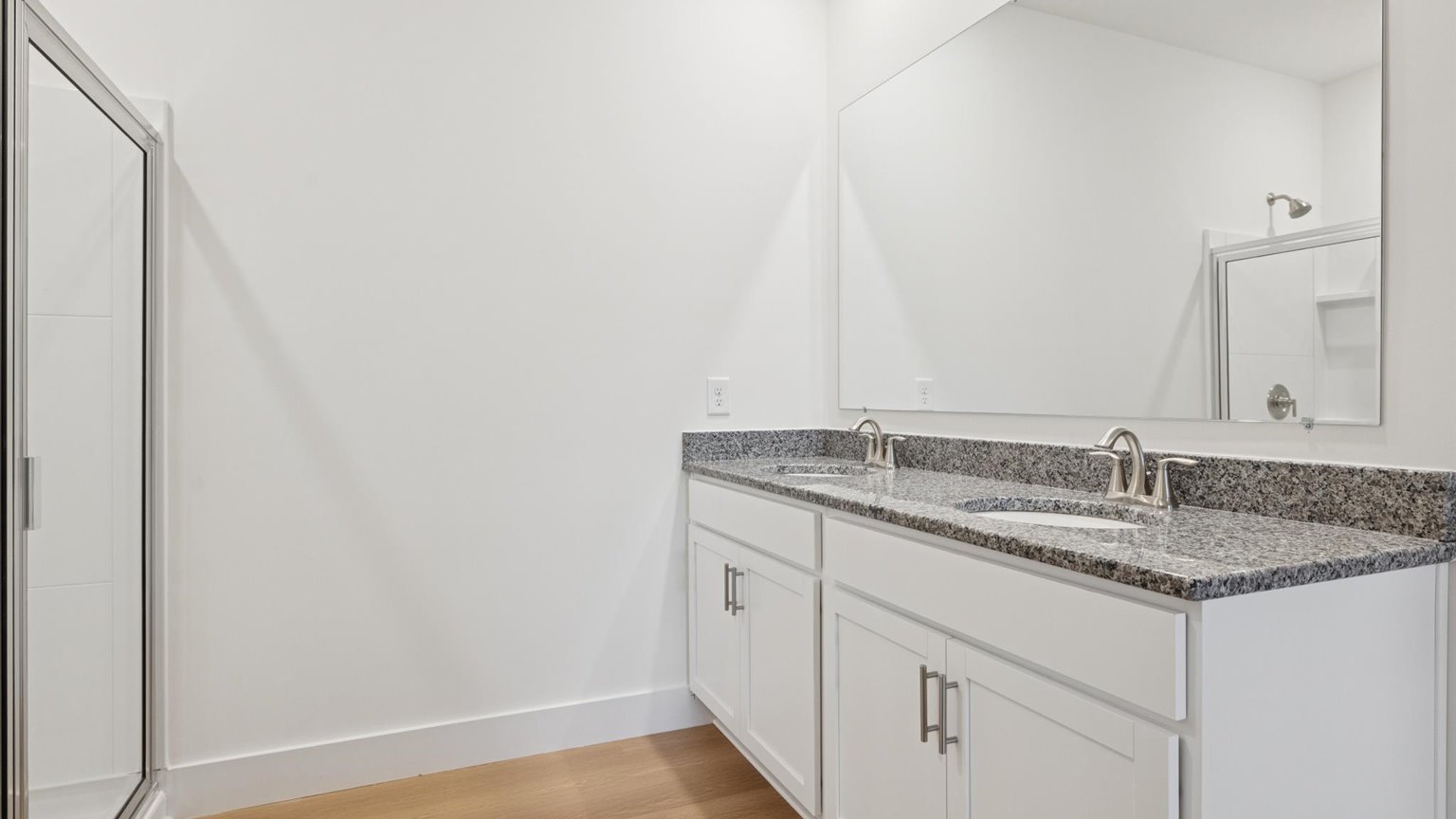 Private attached primary bathroom with built in vanity