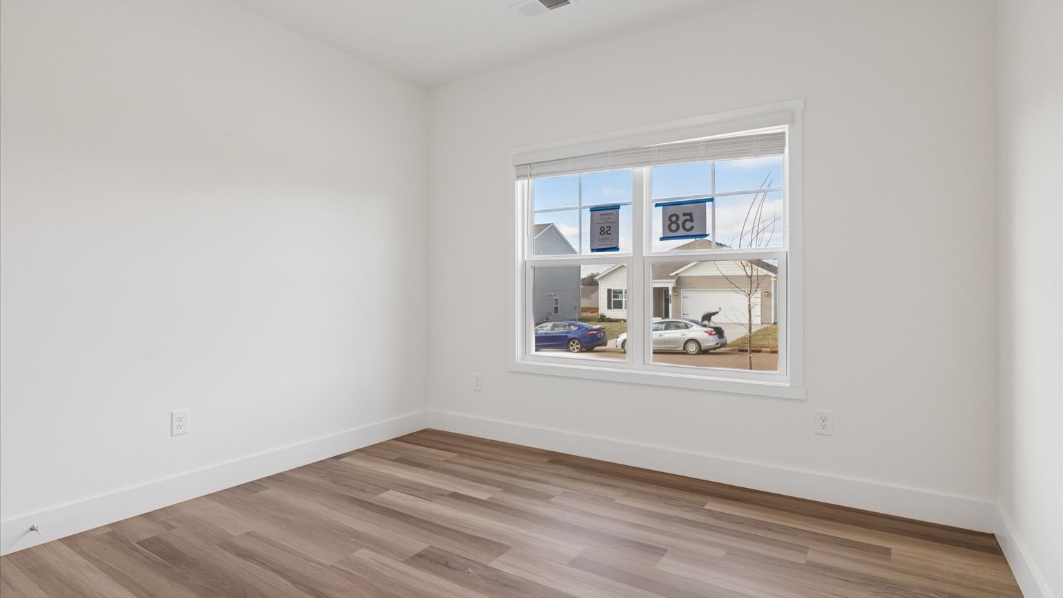 Bedroom with ample natural light and carpet floors