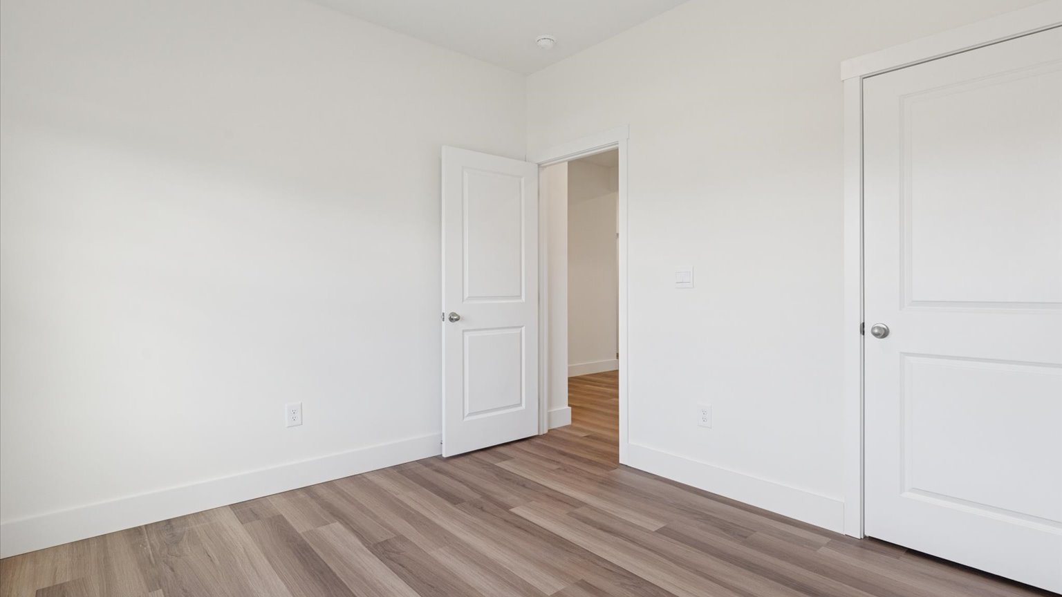 Bedroom with ample natural light and carpet floors