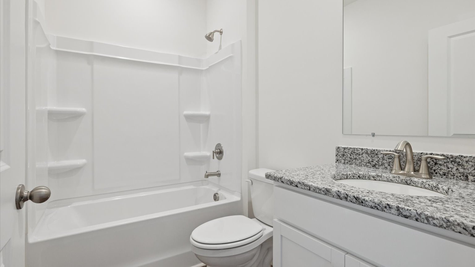 Guest bathroom with built in vanity and combination bathtub shower