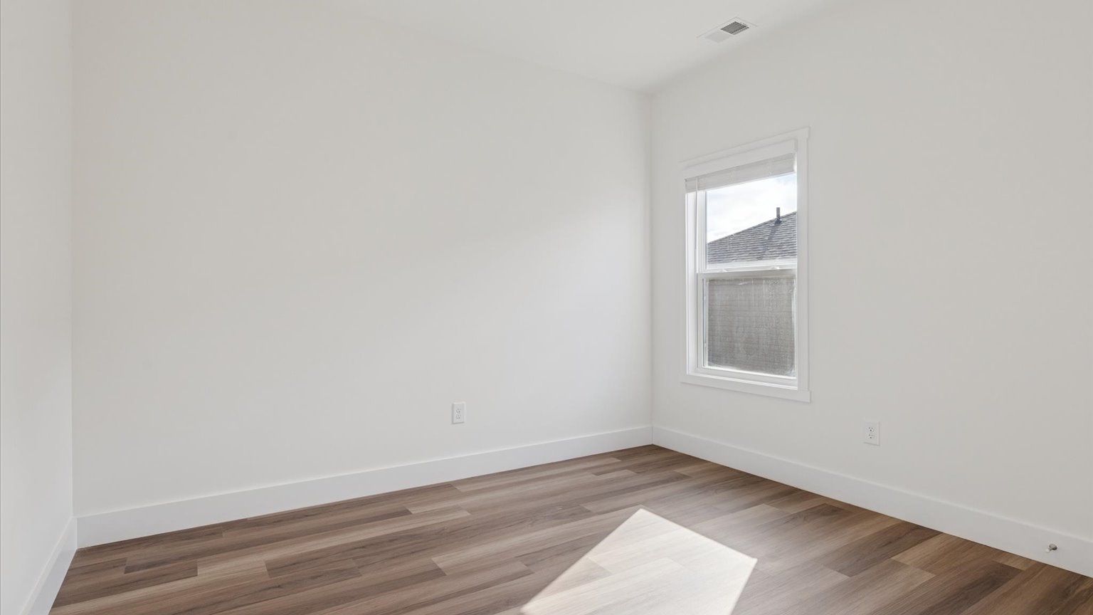 Bedroom with ample natural light and carpet floors