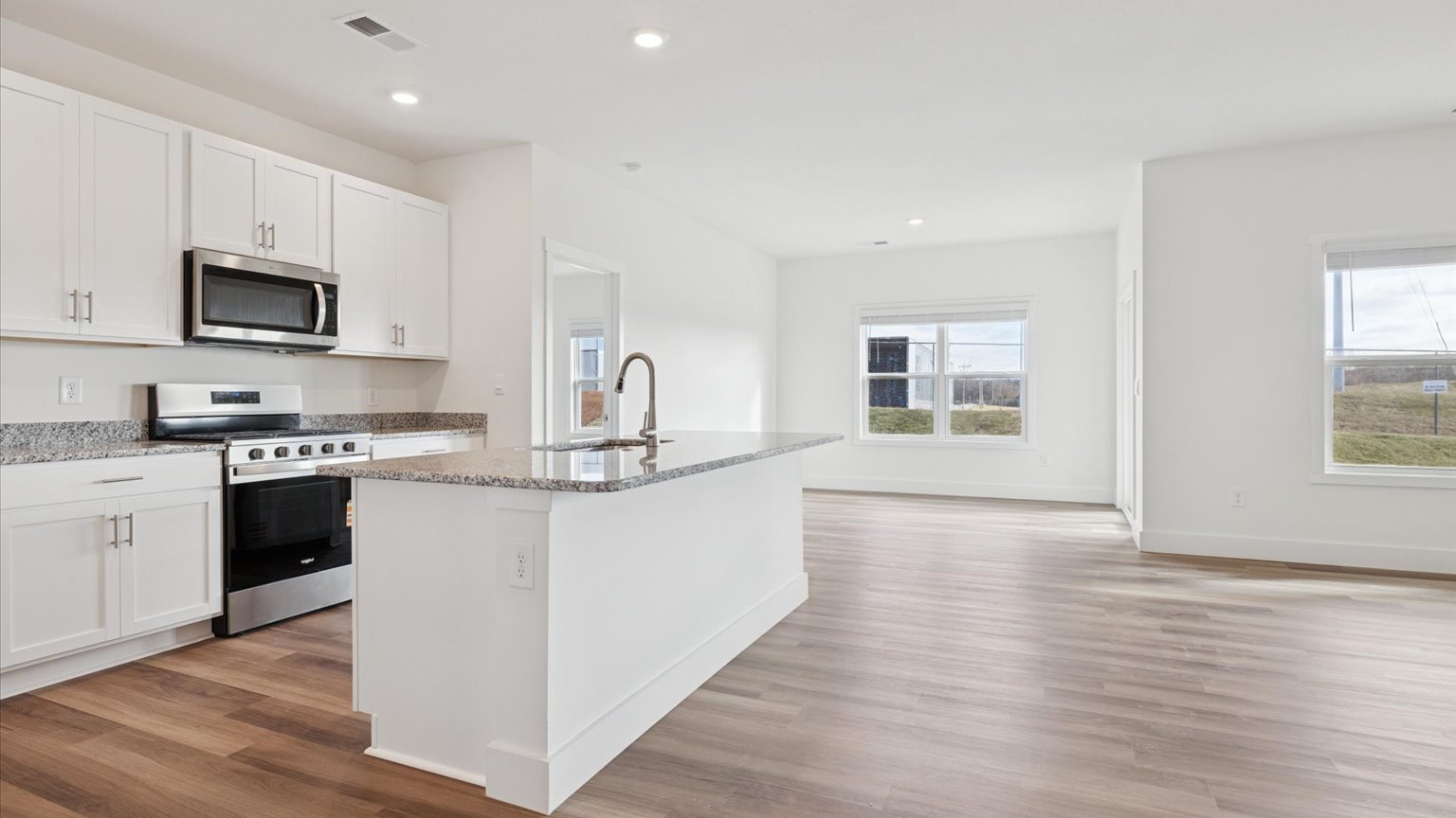 Open living and great room area with ample natural light