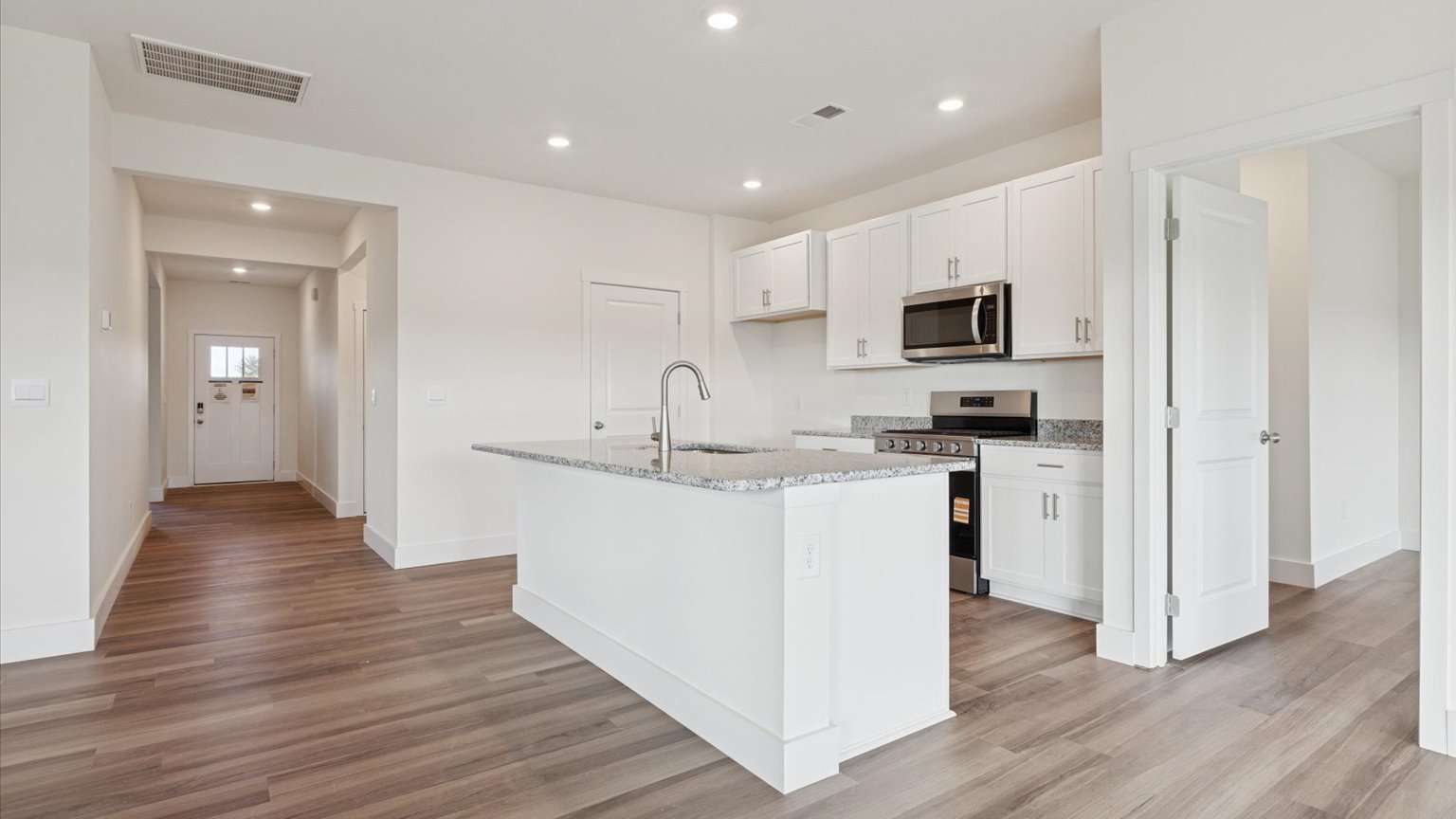 Open living and great room area with ample natural light