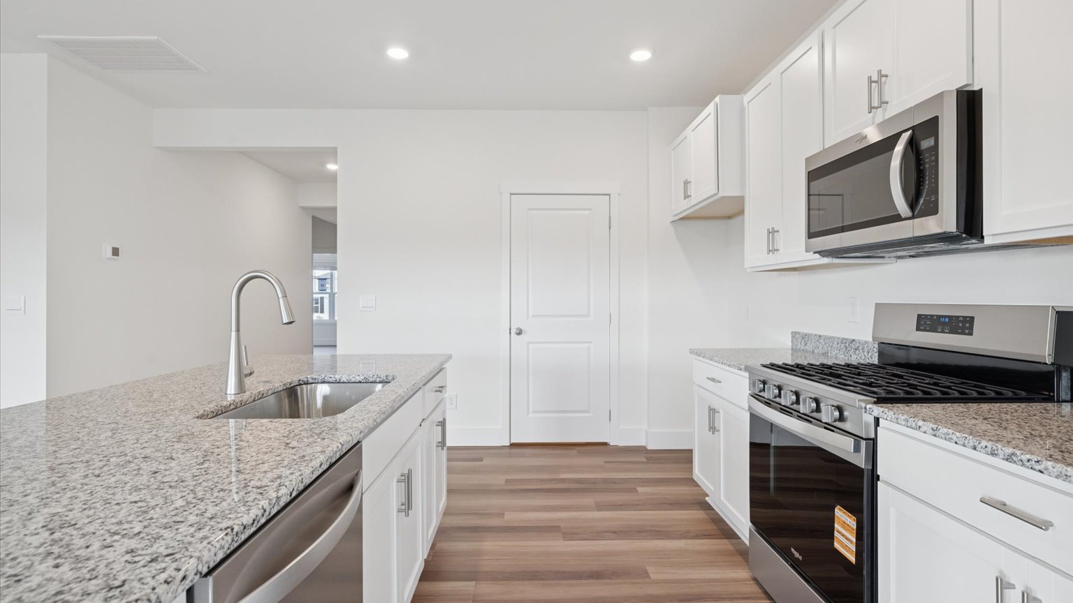 Spacious open concept kitchen with island and counter prep space