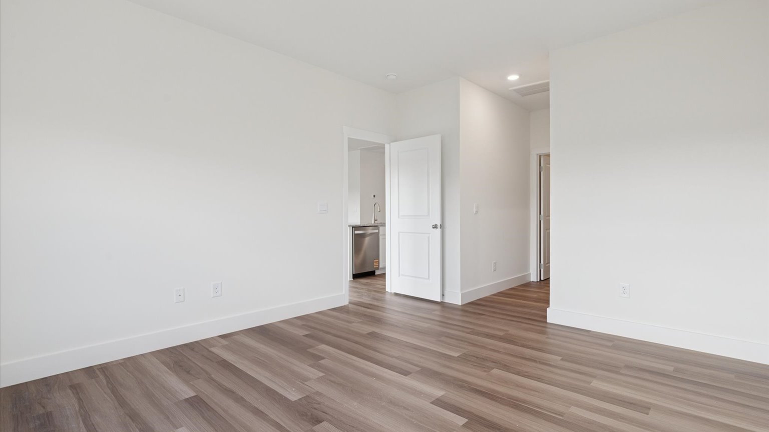 Bedroom with ample natural light and carpet floors