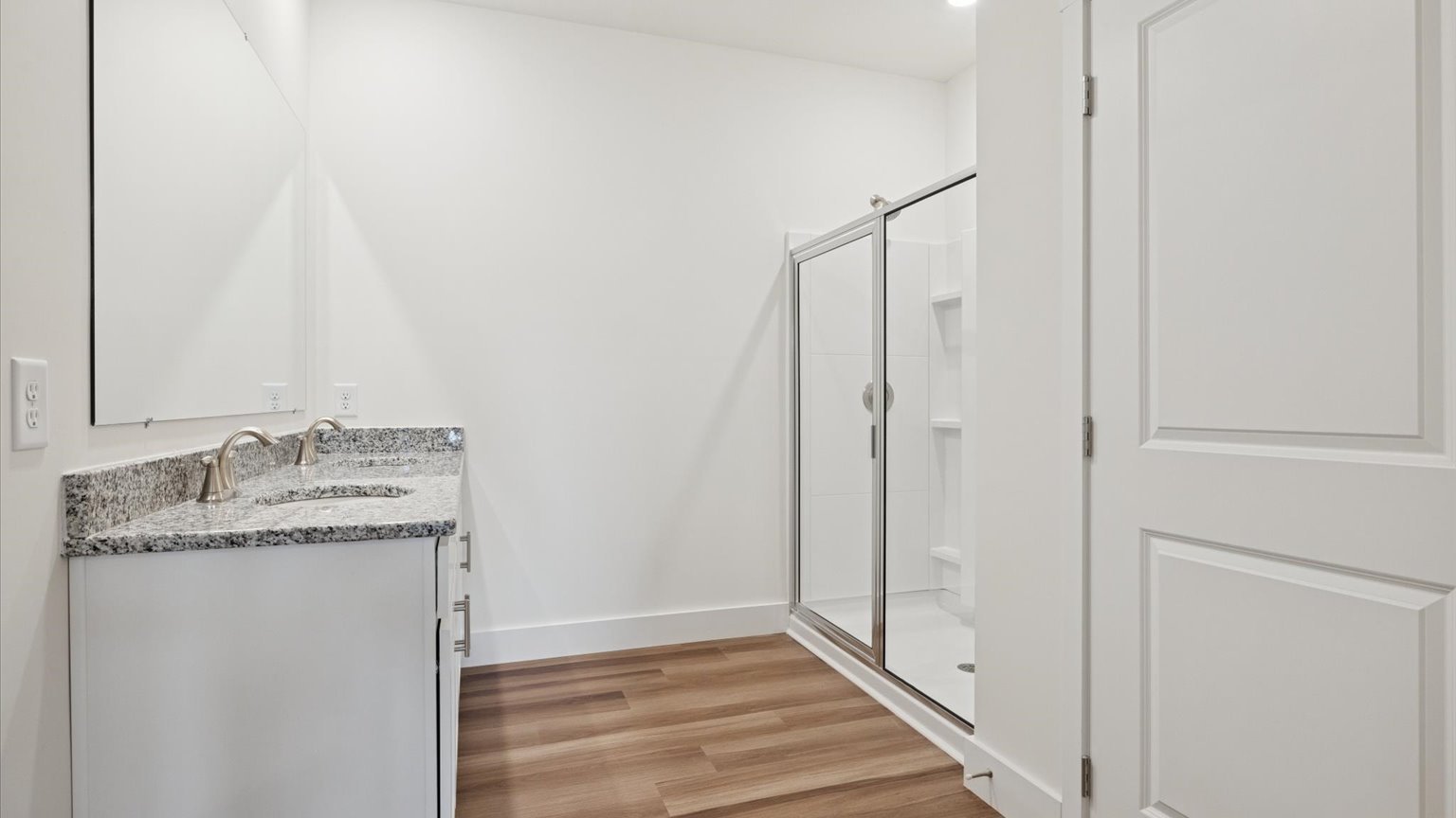 Private attached primary bathroom with built in vanity