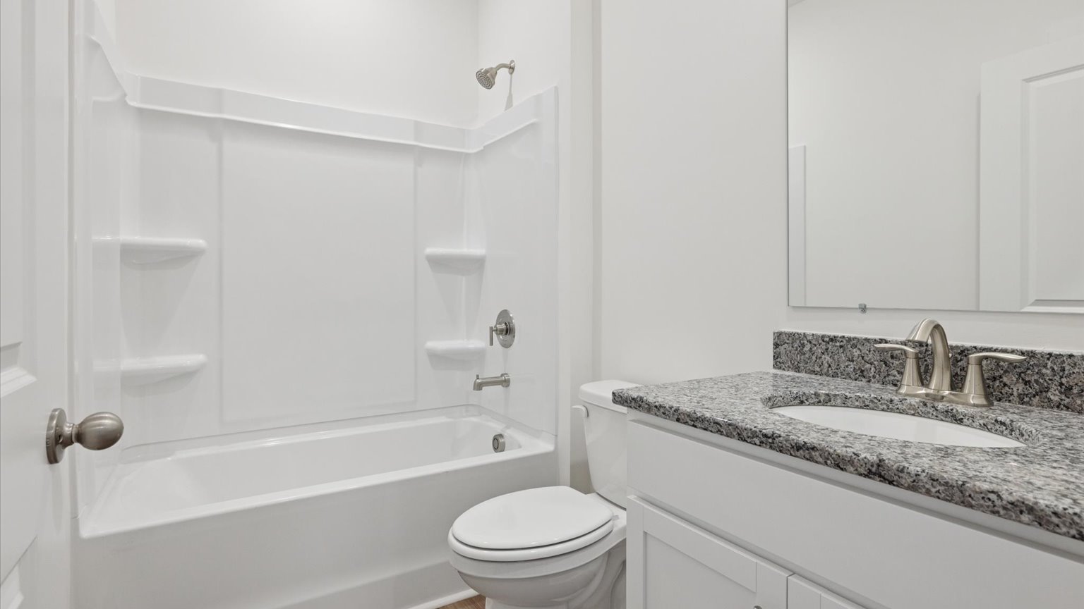 Guest bathroom with built in vanity and combination bathtub shower