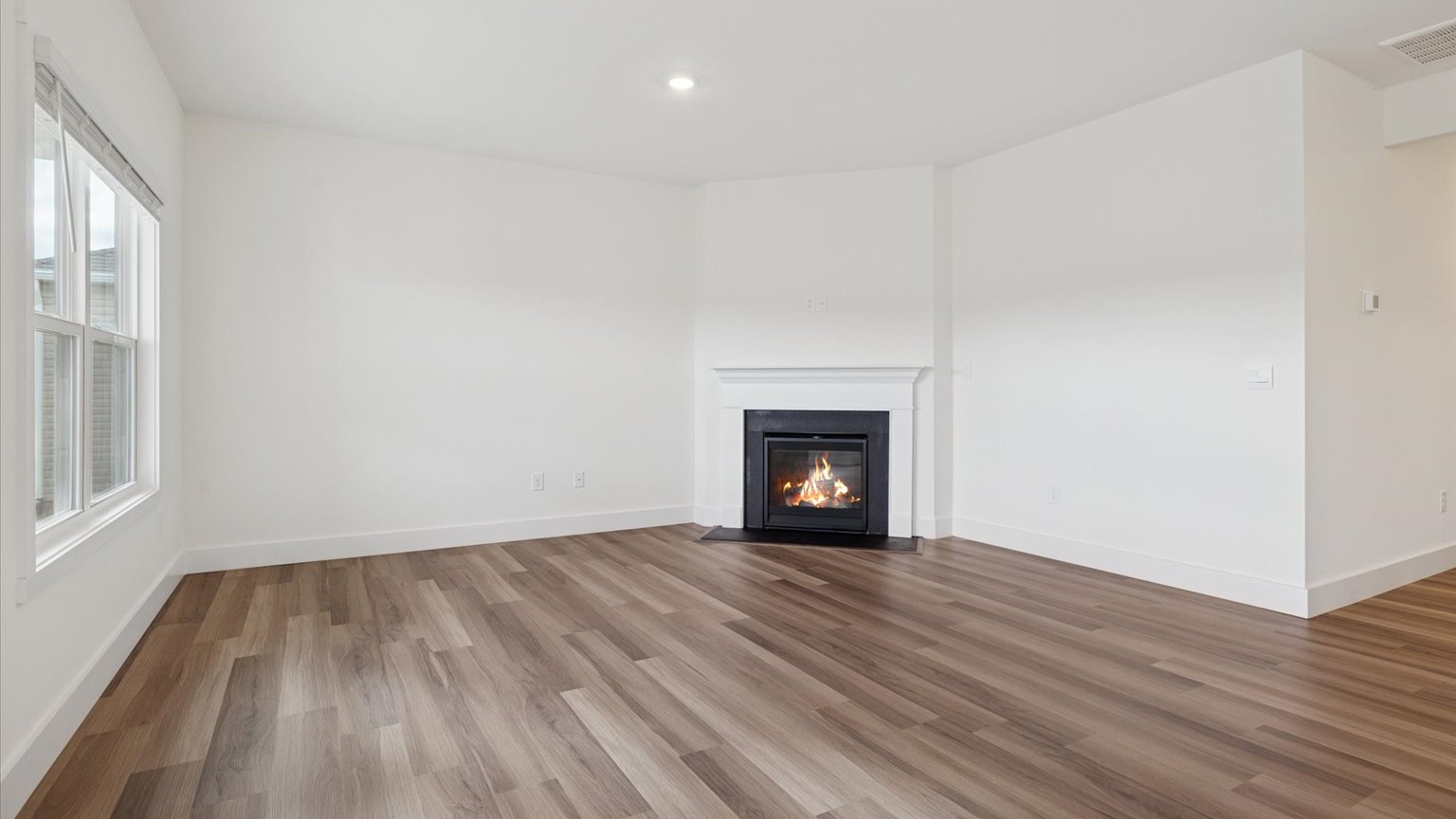 Open concept living, dining, and kitchen space