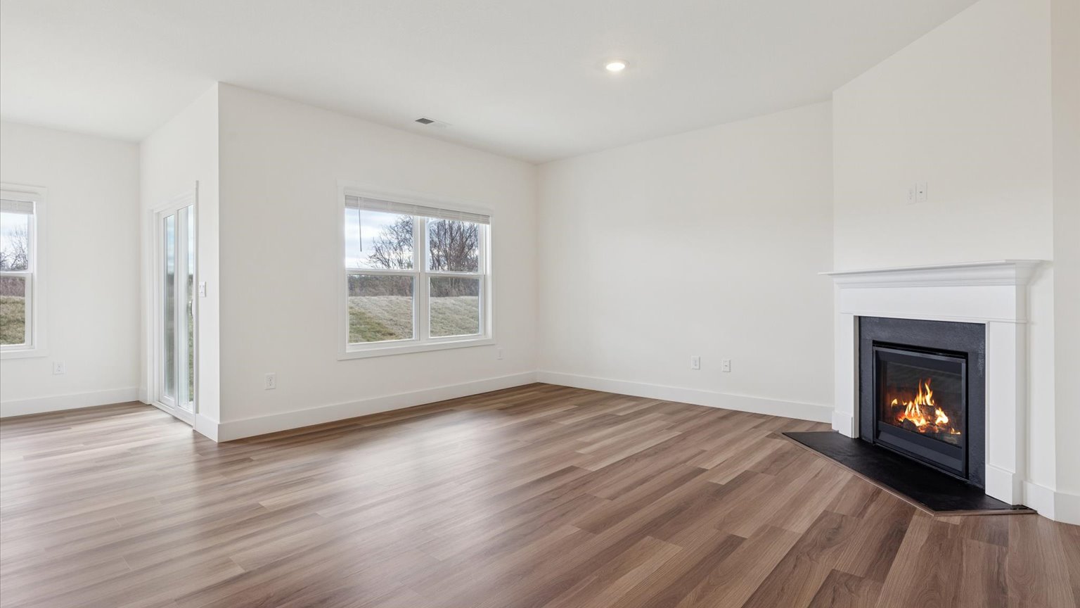 Open concept living, dining, and kitchen space