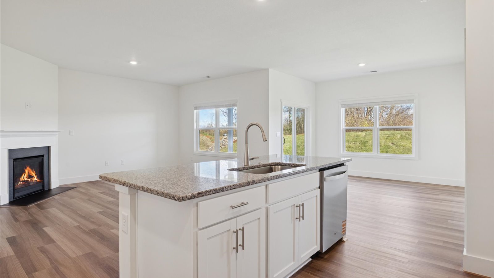 Open concept living, dining, and kitchen space