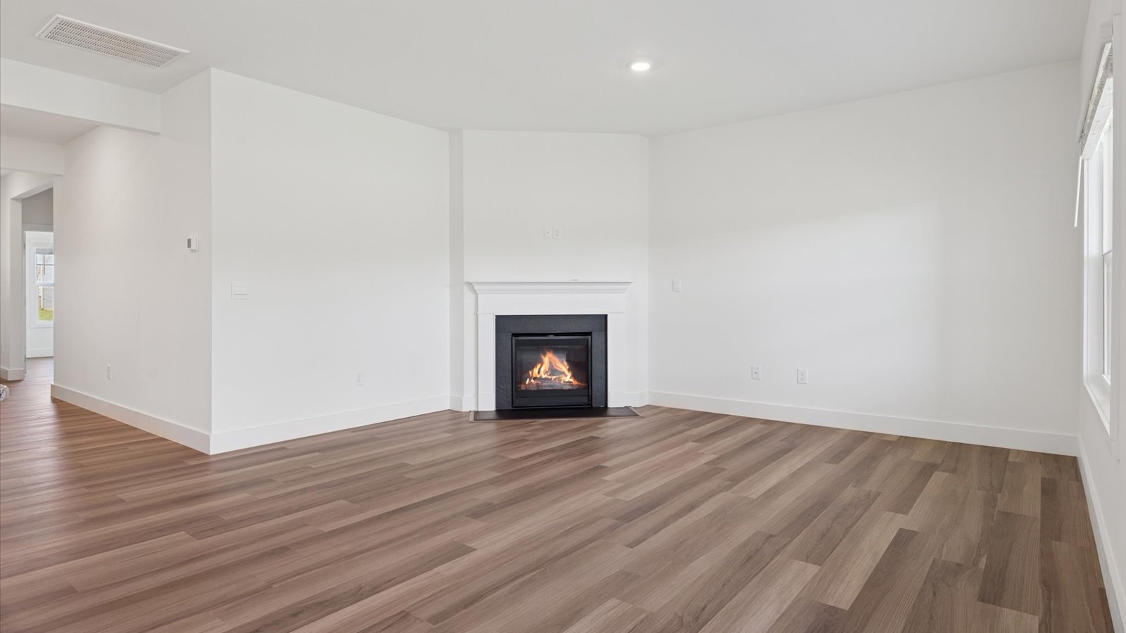 Open concept living, dining, and kitchen space