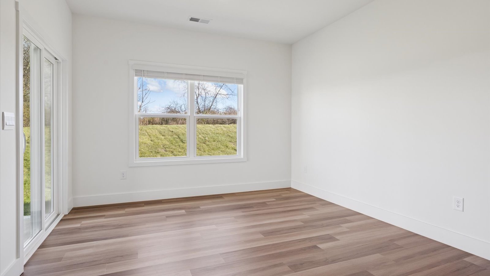 Open concept living, dining, and kitchen space