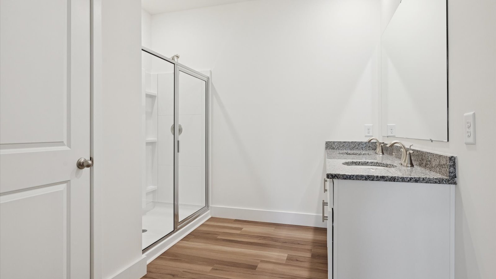 Primary bathroom with luxurious shower and built in storage