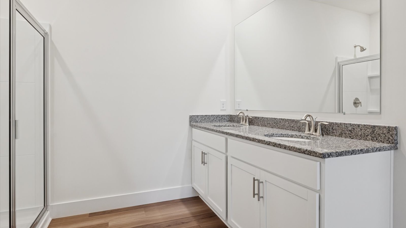 Primary bathroom with luxurious shower and built in storage
