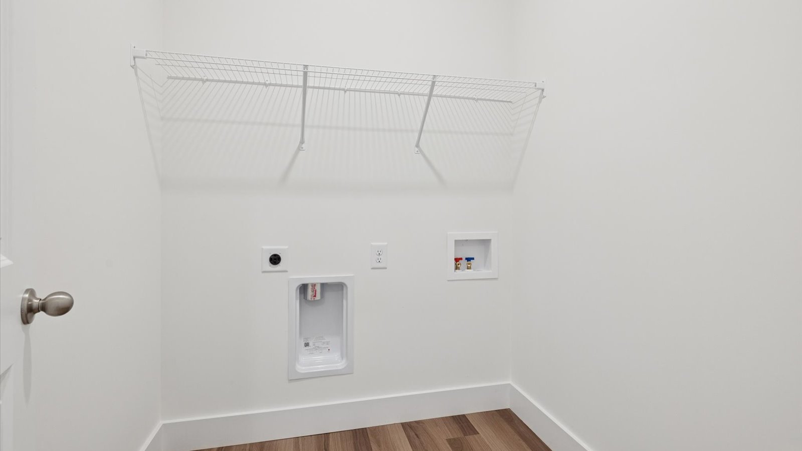 Laundry room and utility closet space with extra storage