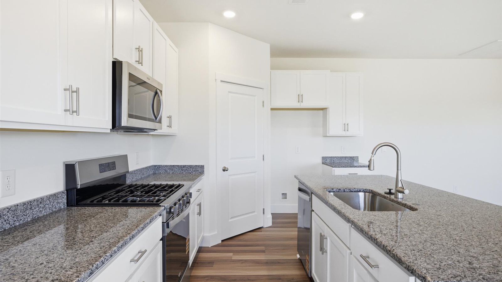 Spacious open concept kitchen with island and counter prep space