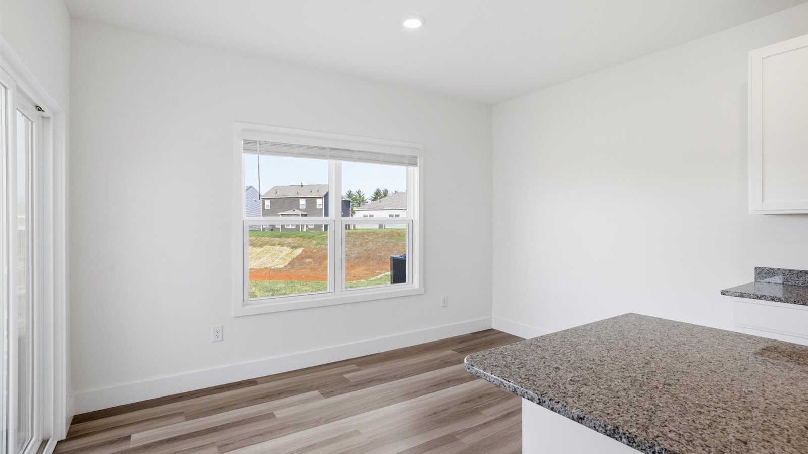 Open concept living, dining, and kitchen space