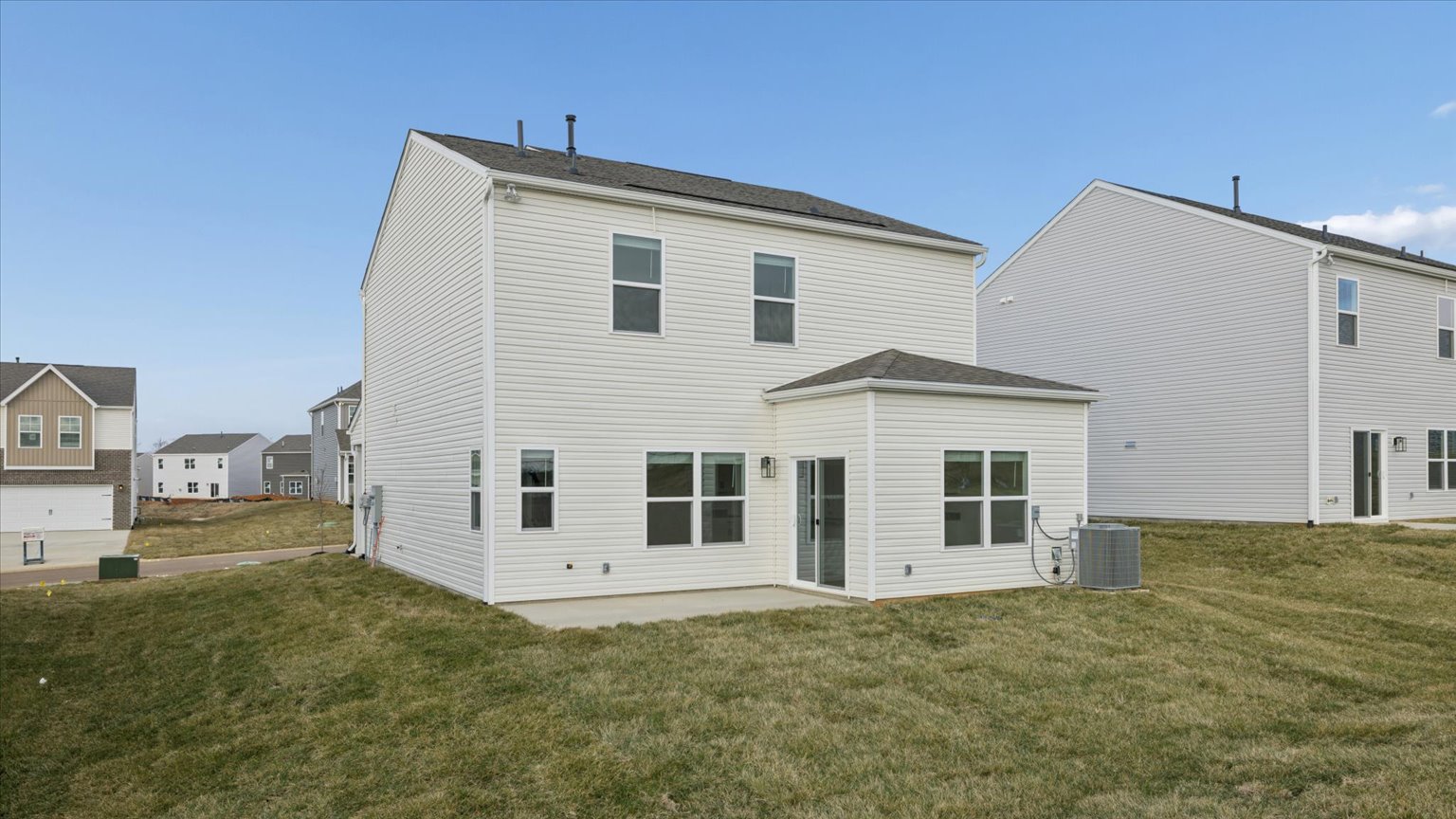 Back exterior of traditional two story home