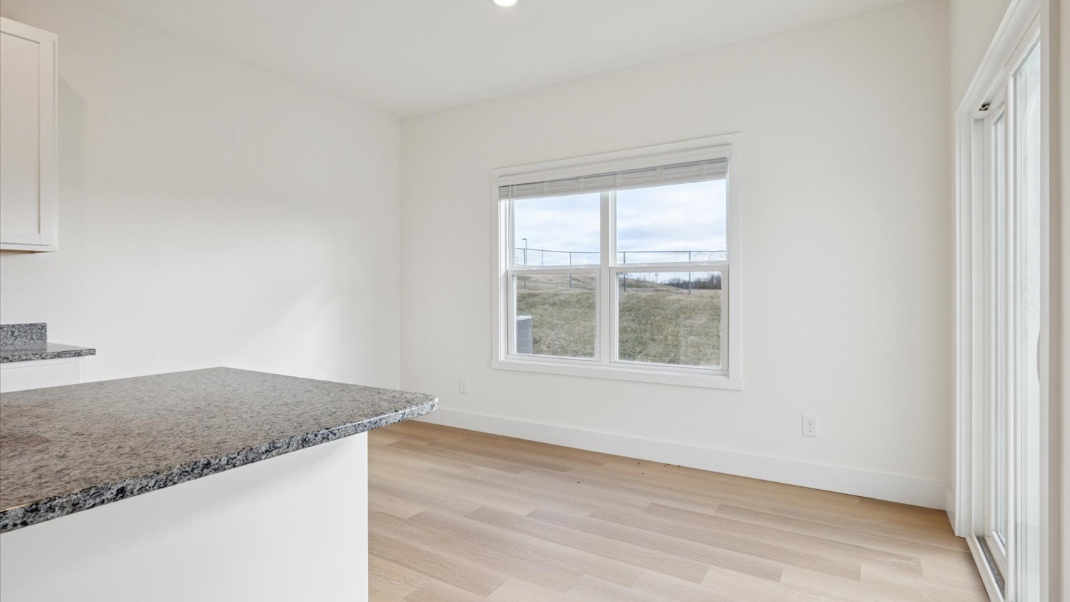 Open concept living, dining, and kitchen space