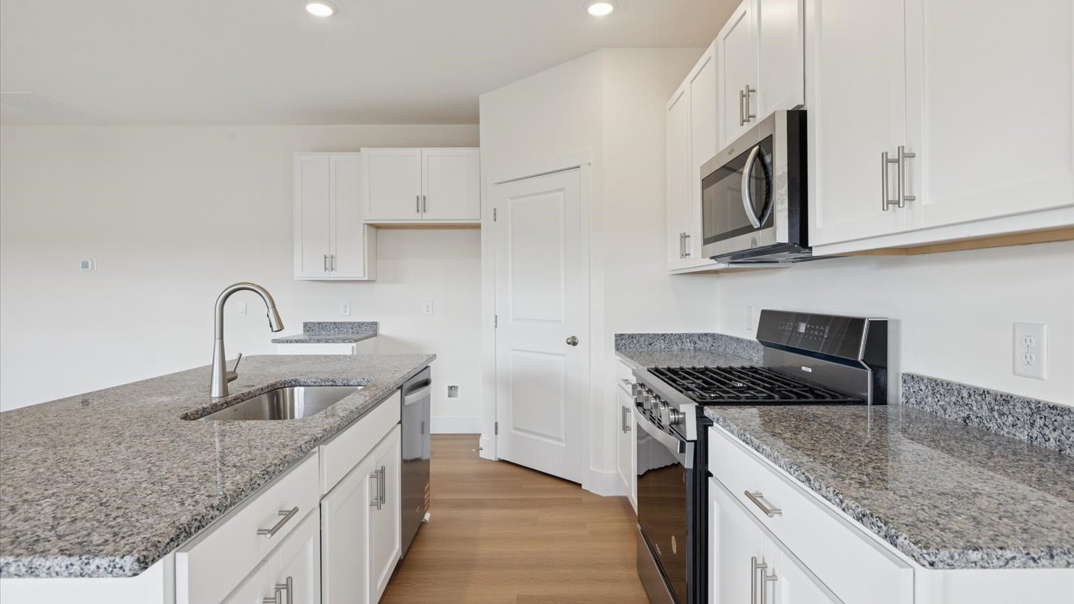 Spacious open concept kitchen with island and counter prep space