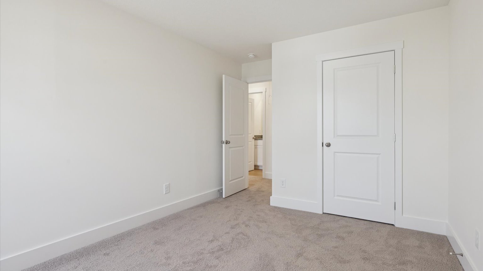 Bedroom with ample natural light and carpet floors