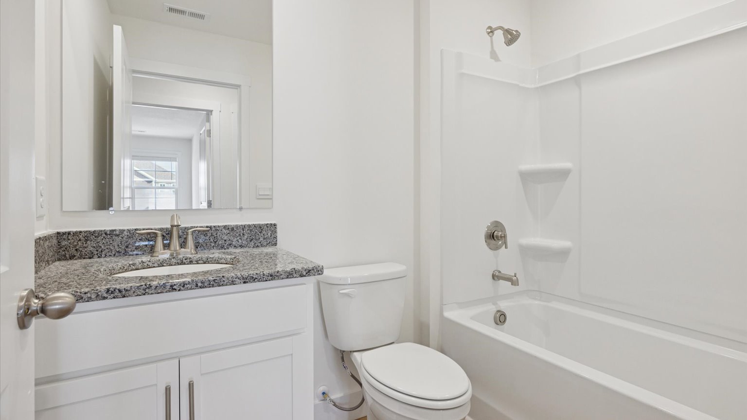 Guest bathroom with built in vanity and combination bathtub shower