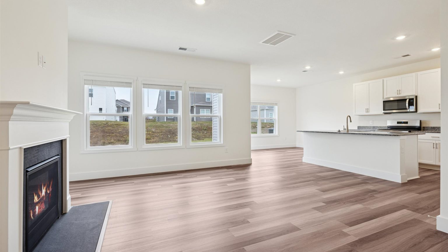 Open concept kitchen, living, and dining room space