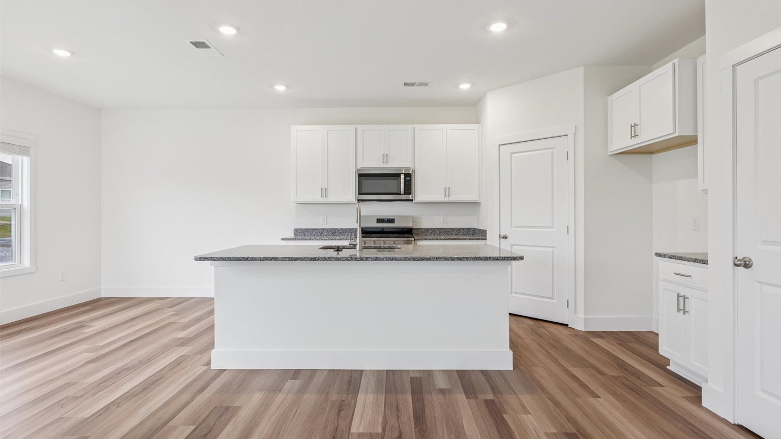Open concept kitchen, living, and dining room space