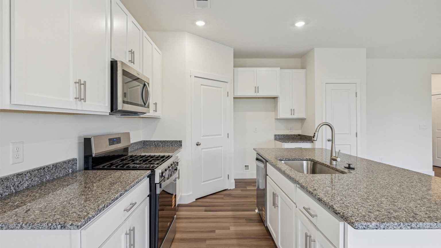 Spacious open concept kitchen with island and counter prep space