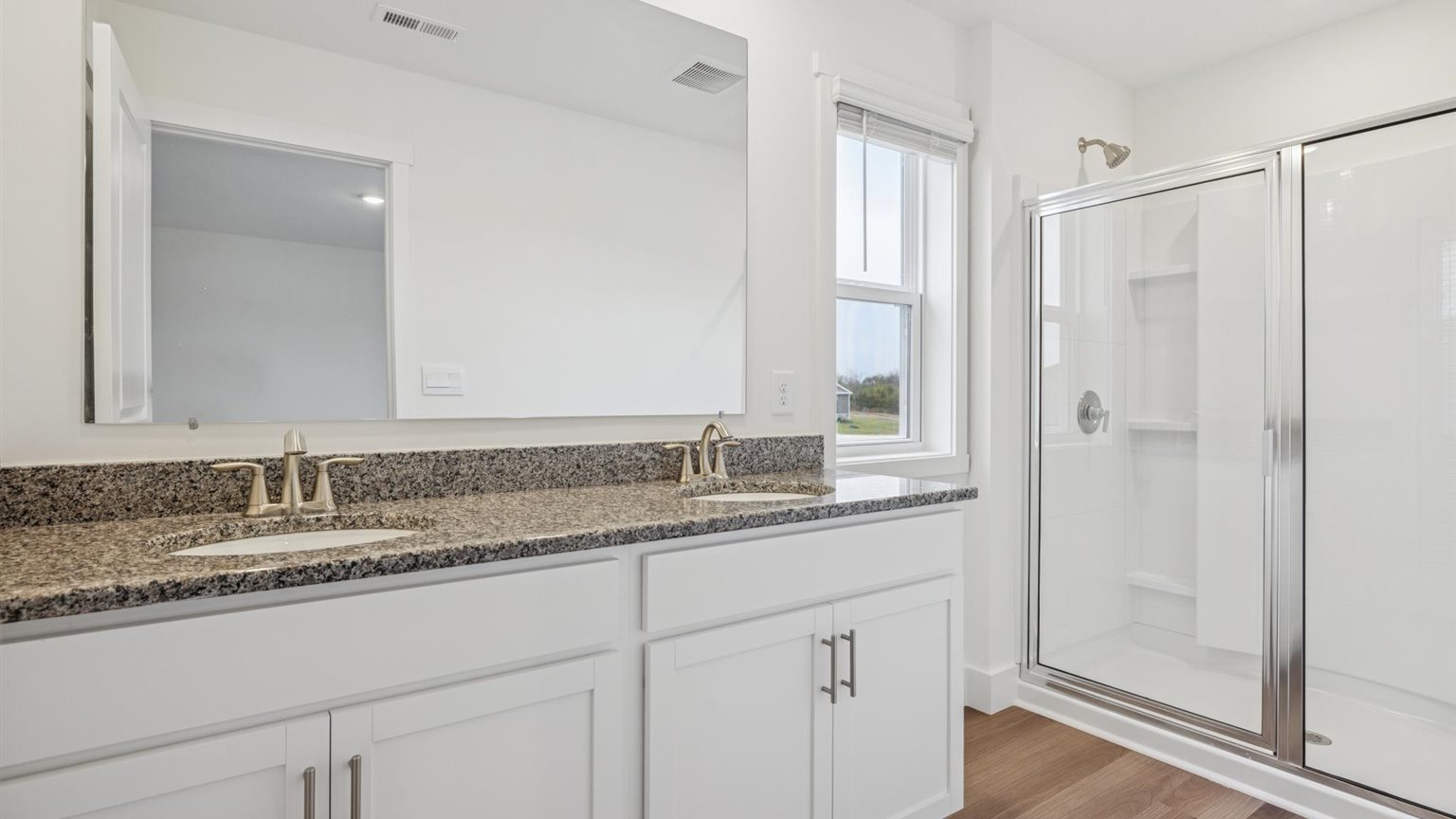 Private attached primary bathroom with built in vanity