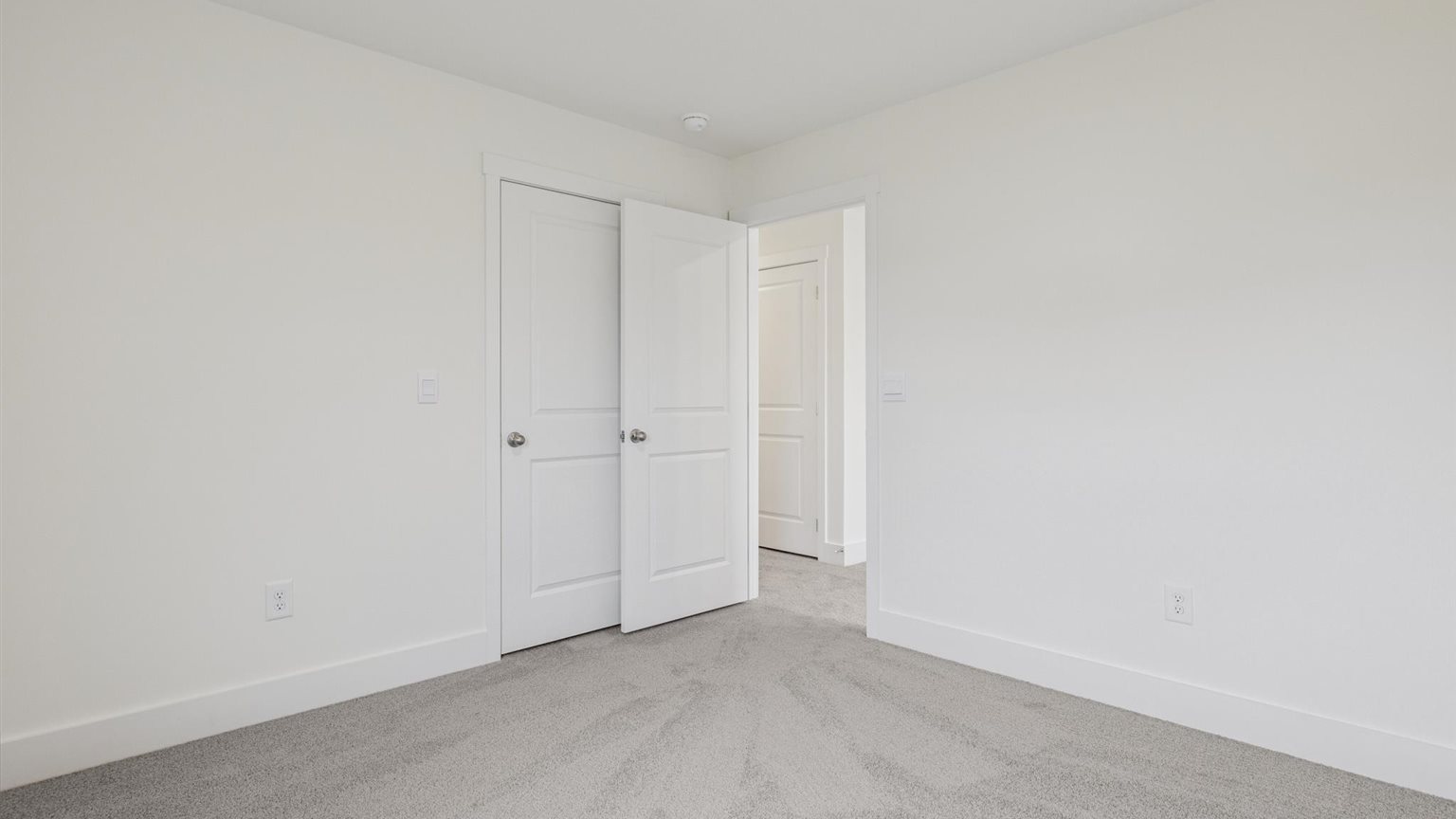 Bedroom with ample natural light and carpet floors