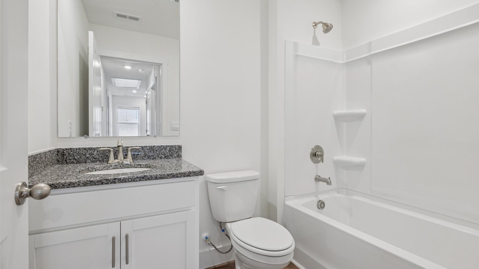 Upstairs bathroom with combination shower and bathtub