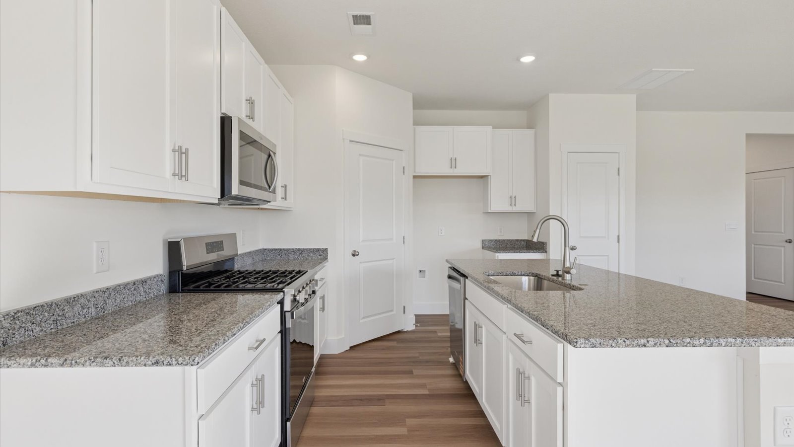 Open concept living, dining, and kitchen space